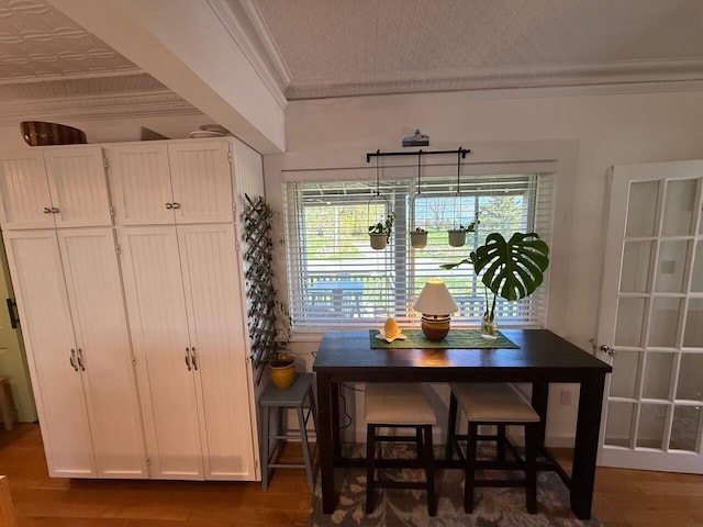 412 N Lubec Rd, Lubec, ME 04652 - dining area with ornamental molding, wood finished floors, and an ornate ceiling