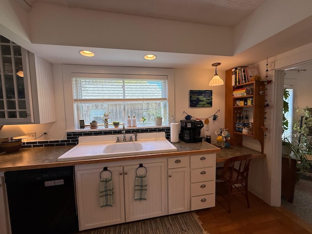 412 N Lubec Rd, Lubec, ME 04652 - kitchen with black dishwasher, white cabinetry, glass insert cabinets, recessed lighting, and a sink