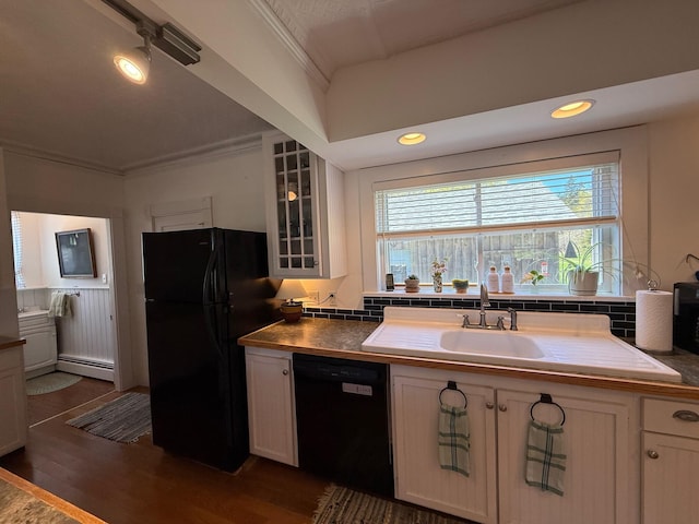 412 N Lubec Rd, Lubec, ME 04652 - kitchen with black appliances, a baseboard heating unit, glass insert cabinets, dark wood finished floors, and crown molding