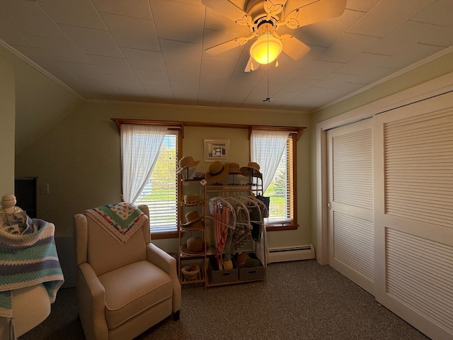412 N Lubec Rd, Lubec, ME 04652 - living area with baseboard heating, crown molding, carpet floors, and a ceiling fan