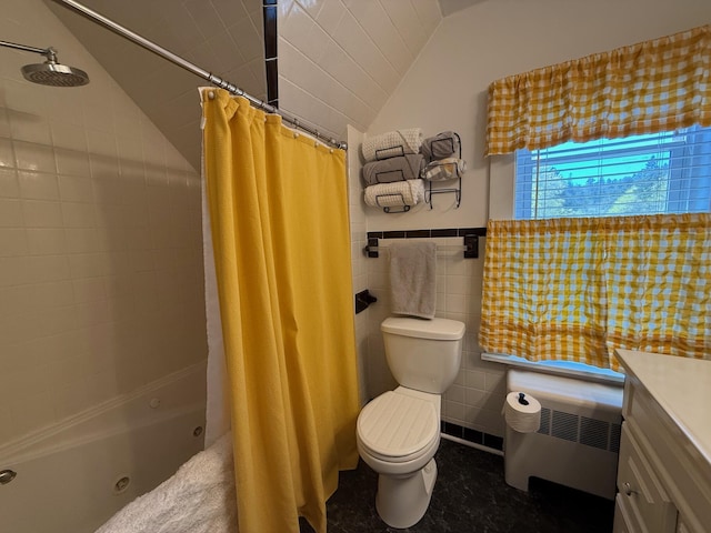 412 N Lubec Rd, Lubec, ME 04652 - full bath featuring lofted ceiling, a combined bath / shower with jetted tub, vanity, toilet, and radiator heating unit