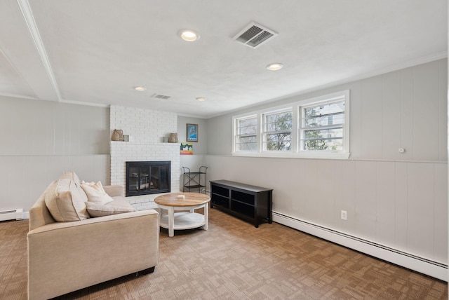 living area featuring a baseboard heating unit, recessed lighting, a fireplace, and visible vents