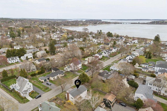 birds eye view of property featuring a water view and a residential view