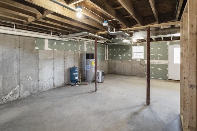 255 Cushing Rd, Cushing, ME 04863 - below grade area featuring water heater and a water pressure tank