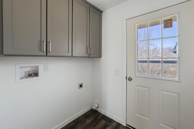 255 Cushing Rd, Cushing, ME 04863 - washroom with hookup for an electric dryer, baseboards, washer hookup, cabinet space, and dark wood finished floors