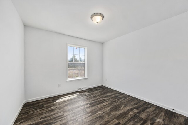 255 Cushing Rd, Cushing, ME 04863 - unfurnished room with dark wood-style flooring and baseboards