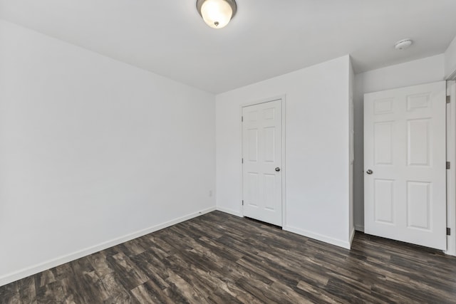 255 Cushing Rd, Cushing, ME 04863 - unfurnished bedroom with dark wood finished floors and baseboards