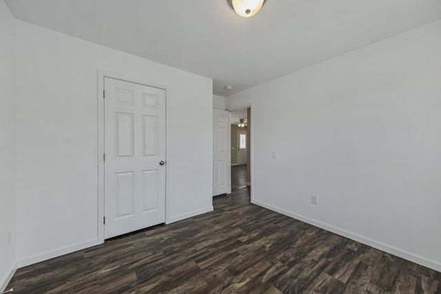 255 Cushing Rd, Cushing, ME 04863 - unfurnished bedroom with dark wood-style floors and baseboards