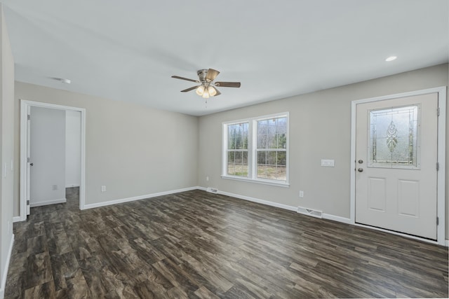 255 Cushing Rd, Cushing, ME 04863 - unfurnished living room featuring dark wood-style flooring, ceiling fan, baseboards, and recessed lighting