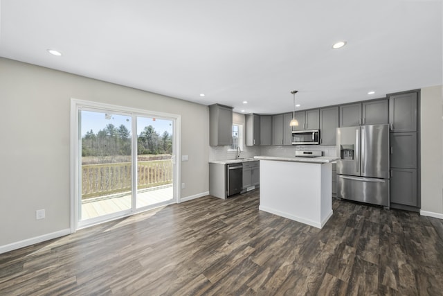 255 Cushing Rd, Cushing, ME 04863 - kitchen featuring stainless steel appliances, a sink, gray cabinets, dark wood-style floors, and recessed lighting