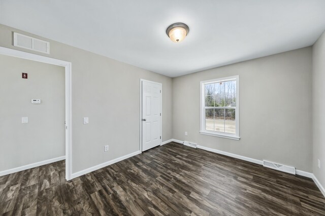 255 Cushing Rd, Cushing, ME 04863 - spare room with dark wood-style flooring and baseboards