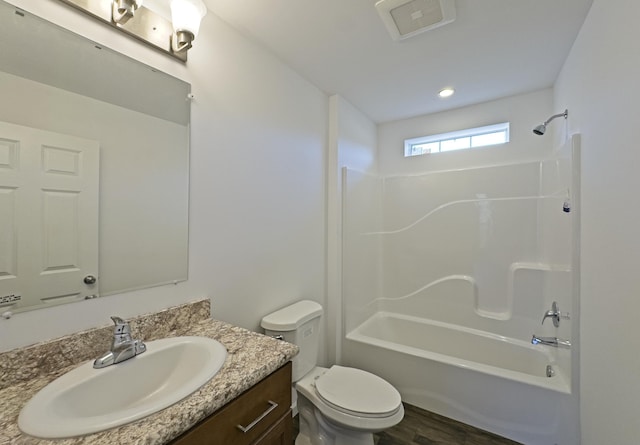 255 Cushing Rd, Cushing, ME 04863 - full bath featuring vanity, toilet, shower / bath combination, and wood finished floors