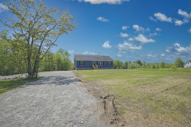 255 Cushing Rd, Cushing, ME 04863 - view of front of house featuring gravel driveway and a front yard
