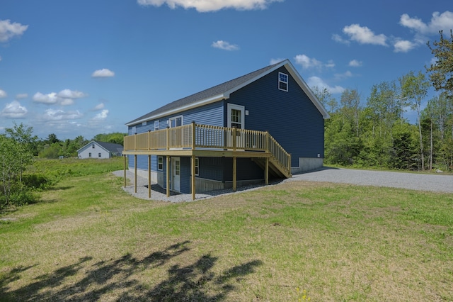255 Cushing Rd, Cushing, ME 04863 - back of house featuring a wooden deck and a lawn