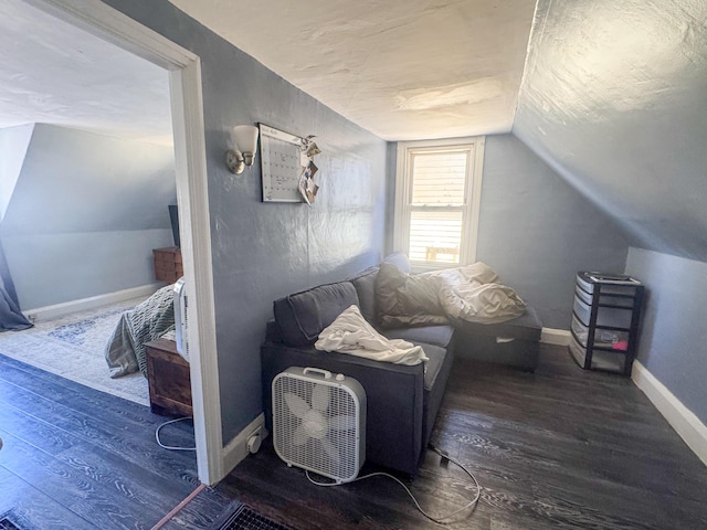 6 Hudson St, Bangor, ME 04401 - living area with baseboards, wood finished floors, and vaulted ceiling