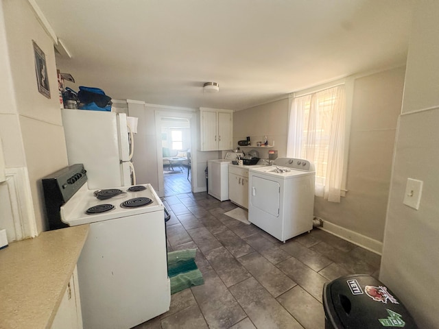 6 Hudson St, Bangor, ME 04401 - kitchen with white cabinetry, washer / clothes dryer, white appliances, and light countertops