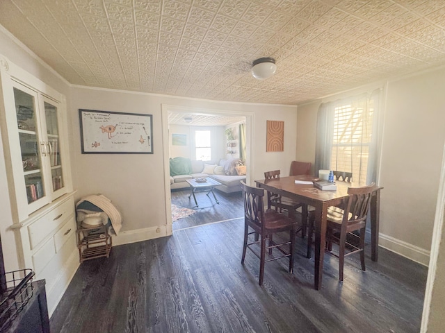 6 Hudson St, Bangor, ME 04401 - dining space with baseboards, ornamental molding, an ornate ceiling, and dark wood-type flooring