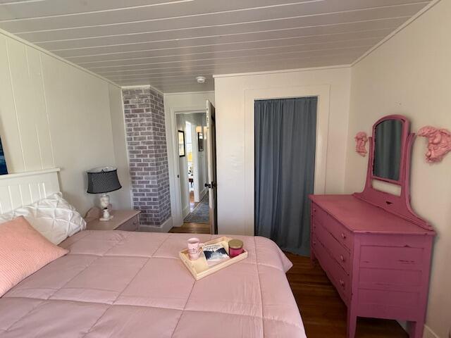 7 Johnson St, Eastport, ME 04631 - bedroom with ornamental molding and wood finished floors