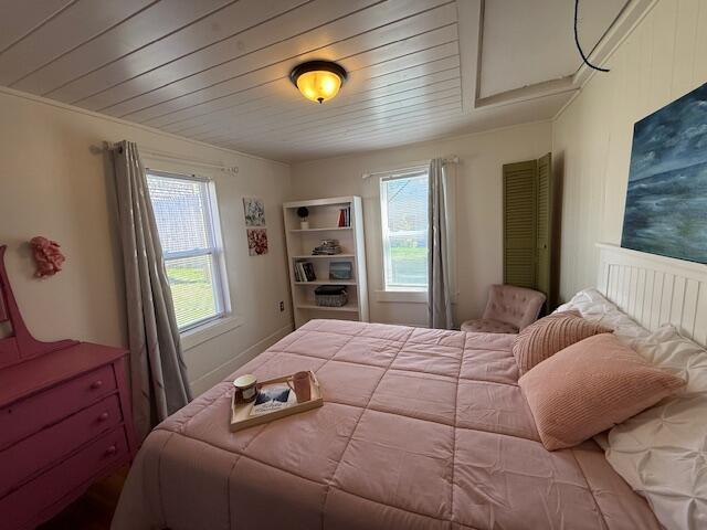 7 Johnson St, Eastport, ME 04631 - bedroom with multiple windows and wood ceiling