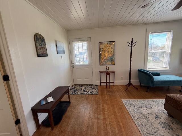 7 Johnson St, Eastport, ME 04631 - entrance foyer with a ceiling fan, wooden ceiling, plenty of natural light, and wood finished floors