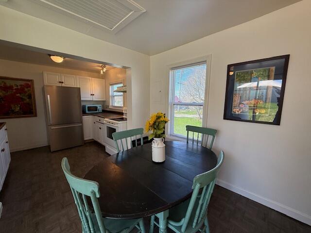 7 Johnson St, Eastport, ME 04631 - dining area with baseboards and parquet floors