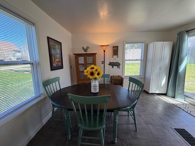 7 Johnson St, Eastport, ME 04631 - dining room with baseboards, a wealth of natural light, and visible vents