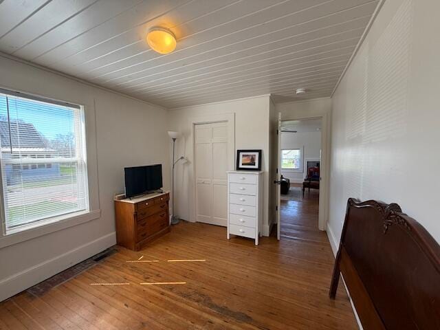 7 Johnson St, Eastport, ME 04631 - bedroom featuring light wood-style flooring, wood ceiling, baseboards, and a closet