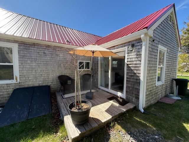 7 Johnson St, Eastport, ME 04631 - rear view of house featuring metal roof and a wooden deck