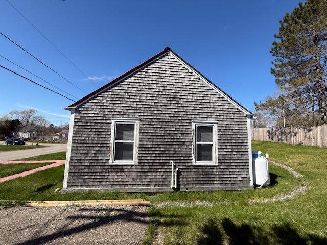 7 Johnson St, Eastport, ME 04631 - view of home's exterior with a yard and fence