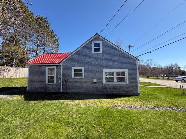 7 Johnson St, Eastport, ME 04631 - back of house featuring a yard and fence