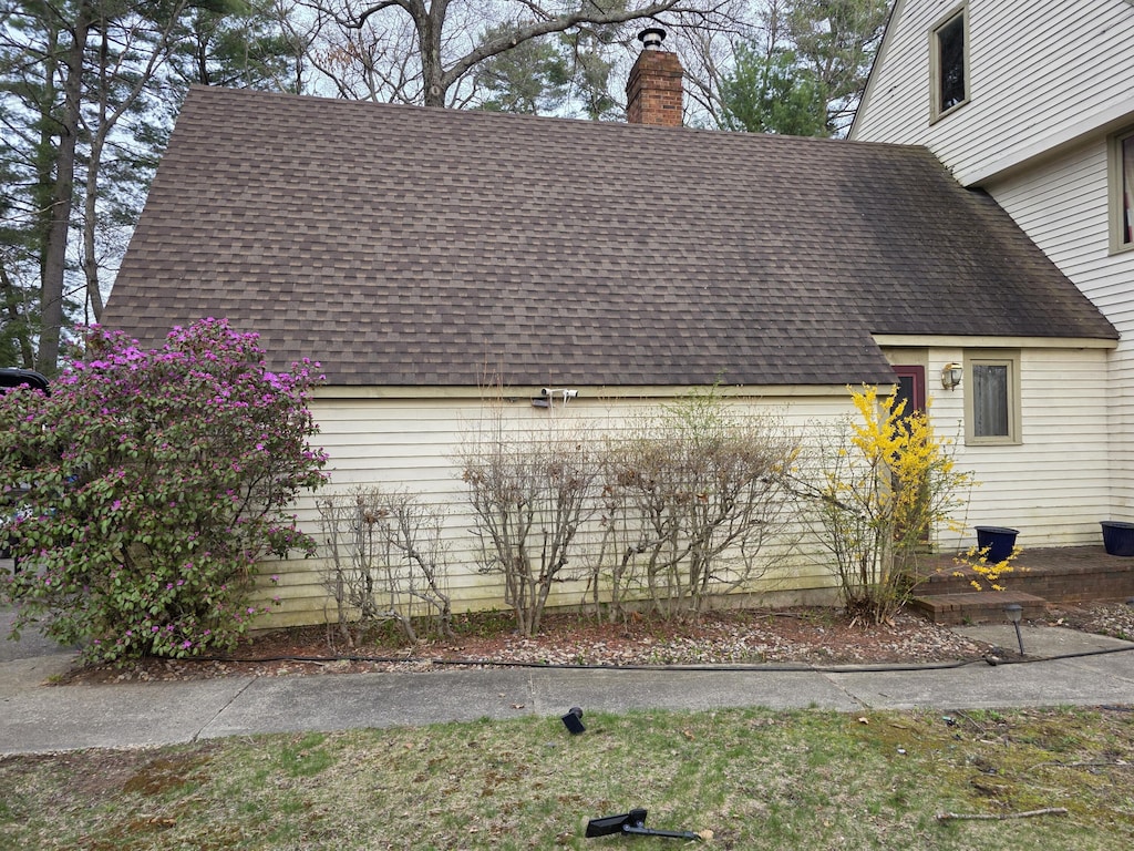 16 Andrew Ave, Sanford, ME 04073 - view of side of property featuring roof with shingles and a chimney
