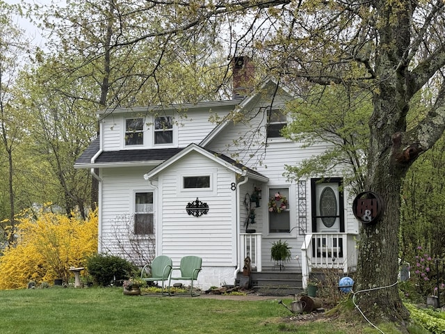 8 Organug Rd, York, ME 03909 - view of front of home with a chimney, a front yard, and a shingled roof