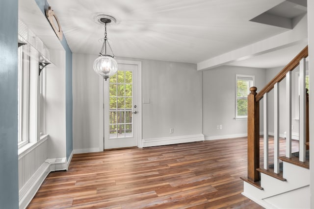 8 Organug Rd, York, ME 03909 - unfurnished dining area with stairway, a baseboard heating unit, plenty of natural light, and wood finished floors
