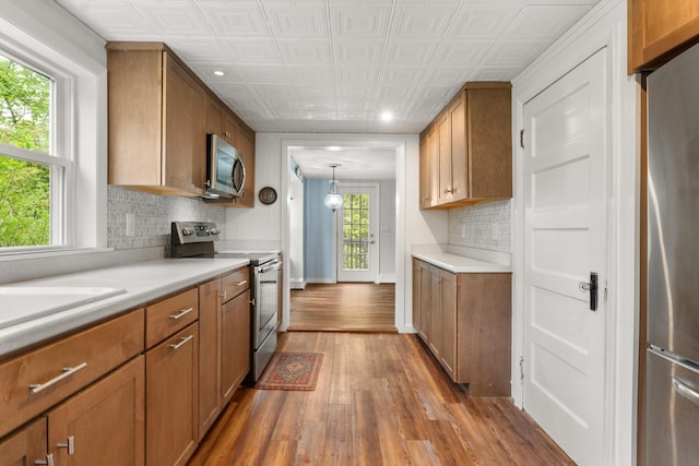 8 Organug Rd, York, ME 03909 - kitchen featuring appliances with stainless steel finishes, decorative backsplash, wood finished floors, light countertops, and recessed lighting