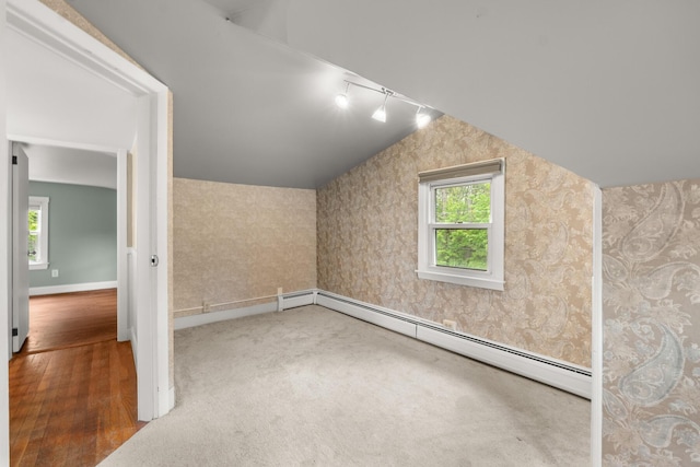 8 Organug Rd, York, ME 03909 - bonus room featuring baseboard heating, wood finished floors, baseboards, and lofted ceiling