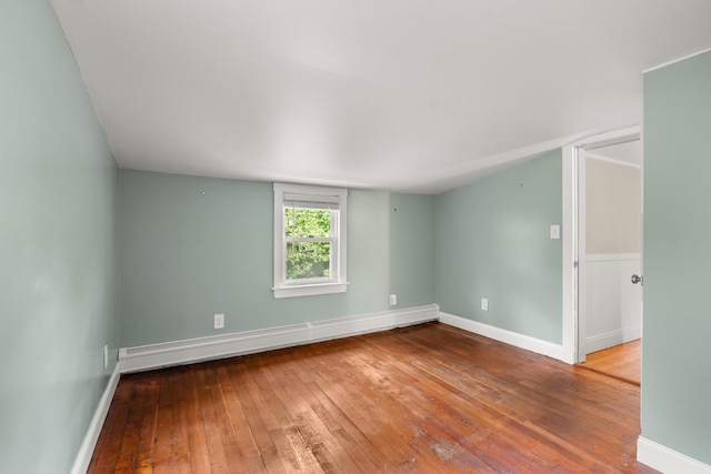 8 Organug Rd, York, ME 03909 - empty room with baseboard heating, wood-type flooring, and baseboards
