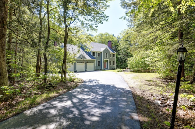 148 Hunter Way, Falmouth, ME 04105 - colonial inspired home featuring asphalt driveway and a chimney