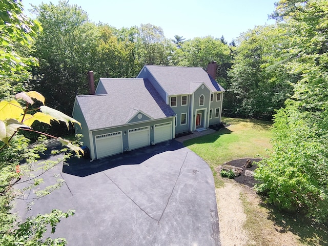 148 Hunter Way, Falmouth, ME 04105 - colonial home featuring driveway, a chimney, a front yard, and roof with shingles