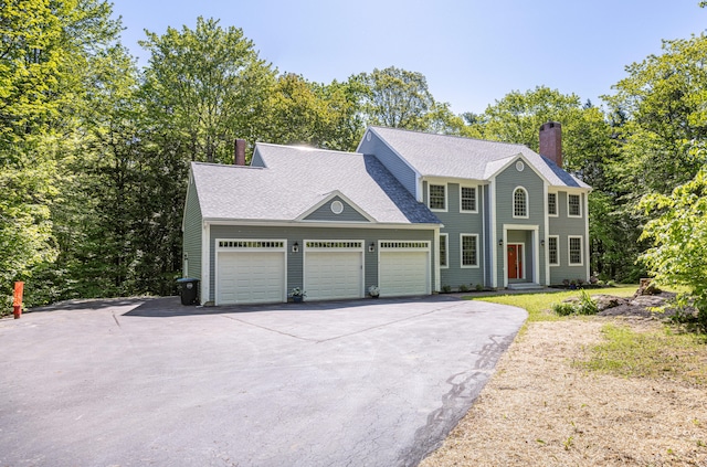 148 Hunter Way, Falmouth, ME 04105 - colonial home featuring driveway, a chimney, a garage, and a shingled roof