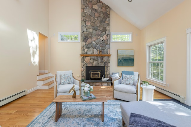 148 Hunter Way, Falmouth, ME 04105 - living area featuring high vaulted ceiling, baseboard heating, wood finished floors, and baseboards