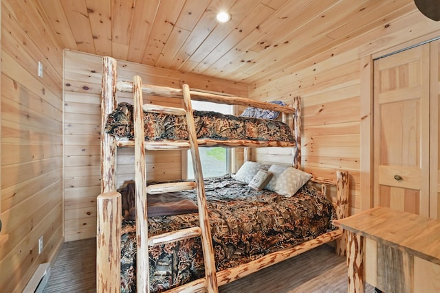 bedroom with wood walls, wood finished floors, and wood ceiling