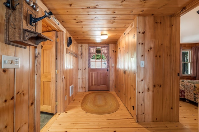 129 Diller Line Rd, Chesterville, ME 04938 - entryway with wooden walls, wooden ceiling, and wood-type flooring