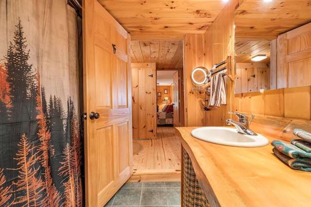 129 Diller Line Rd, Chesterville, ME 04938 - bathroom featuring wood ceiling, vanity, and wooden walls