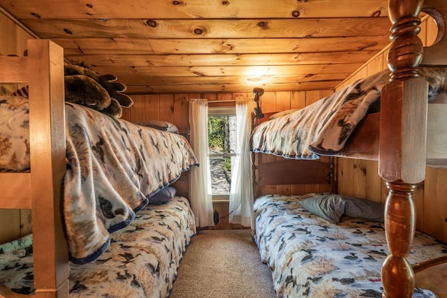 129 Diller Line Rd, Chesterville, ME 04938 - bedroom with wood ceiling, carpet flooring, and wooden walls