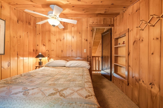 129 Diller Line Rd, Chesterville, ME 04938 - bedroom featuring wooden walls, carpet, and wood ceiling