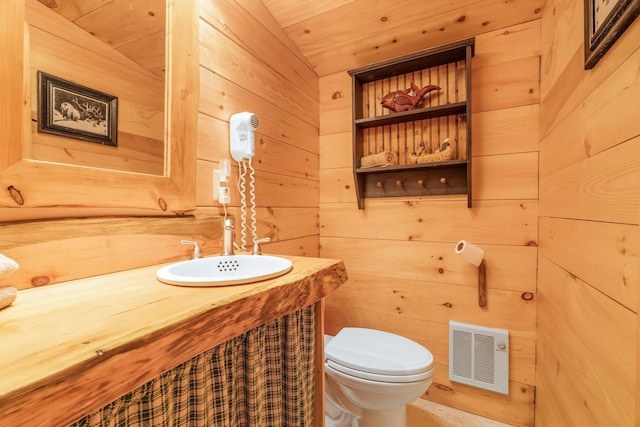 129 Diller Line Rd, Chesterville, ME 04938 - half bath featuring vanity, toilet, and wood walls