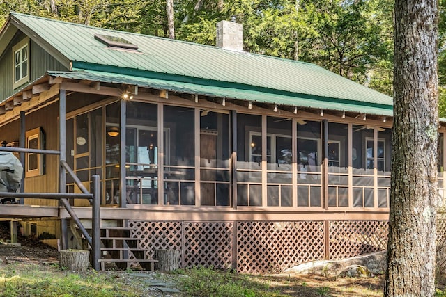 129 Diller Line Rd, Chesterville, ME 04938 - rear view of property with a chimney, a sunroom, stairs, and metal roof