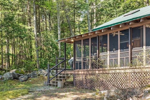 129 Diller Line Rd, Chesterville, ME 04938 - view of outbuilding with a sunroom, a forest view, and stairway