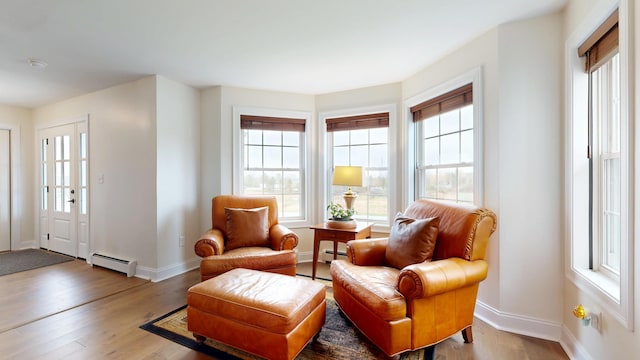 48 Lubear Way, Auburn, ME 04210 - sitting room with a baseboard heating unit, wood finished floors, and baseboards