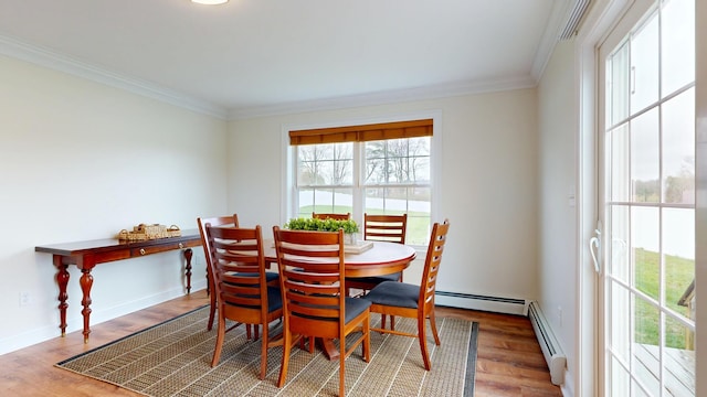 48 Lubear Way, Auburn, ME 04210 - dining room featuring ornamental molding, wood finished floors, baseboard heating, and baseboards